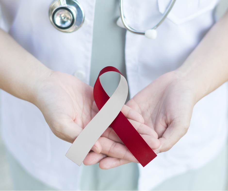 Healthpractitioner with Head and Neck cancer ribbon in hands