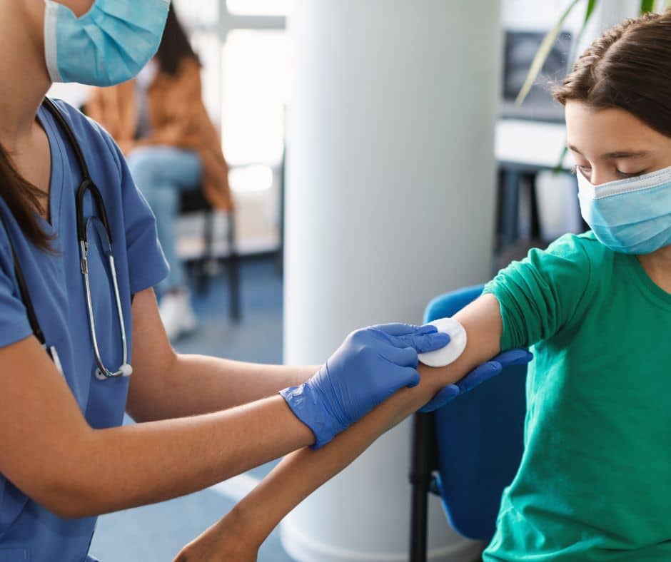 young girl receiving vaccine
