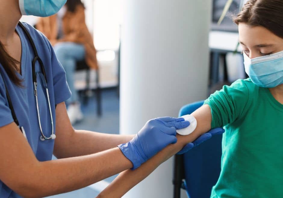 young girl receiving vaccine